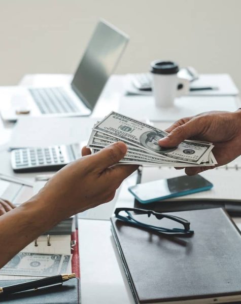 businessman-giving-money-to-his-partner-bribe-and-2023-11-27-05-02-18-utc (1)