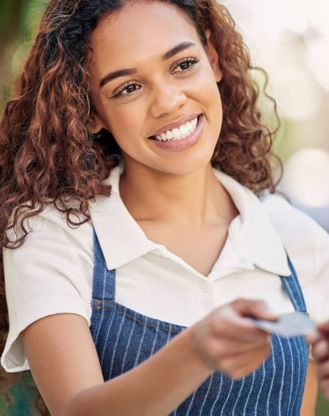 happy-to-help-you-shot-of-a-customer-using-a-card-2023-11-27-05-01-05-utc (1)